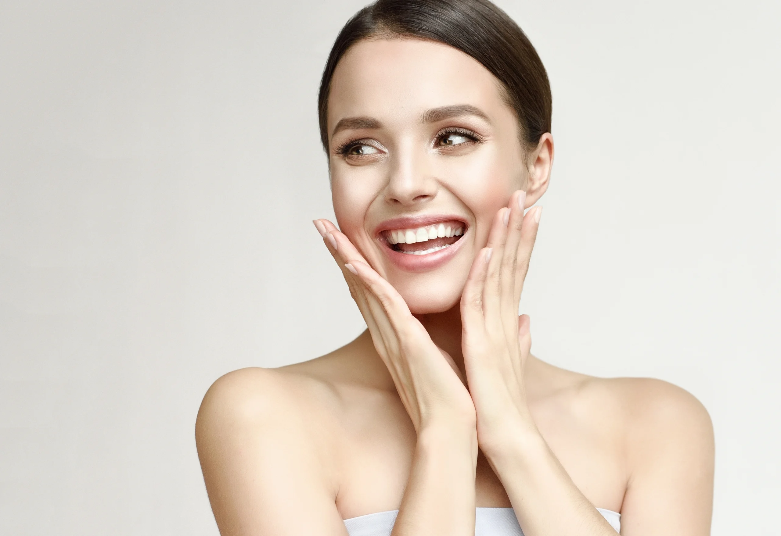 Woman enjoying the effects of IV hydration, glowing skin and smile.